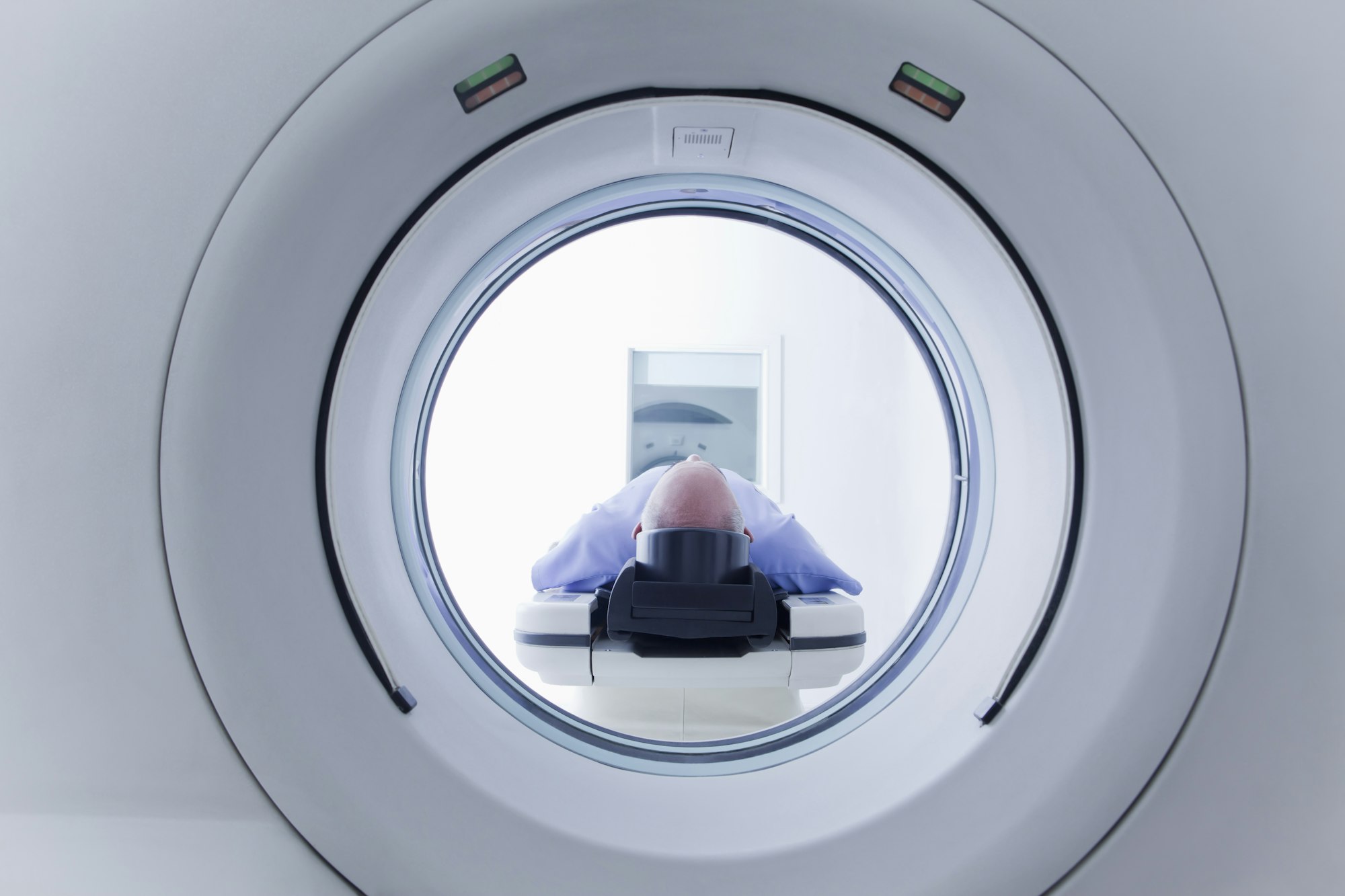 Patient lying down on CT scanner